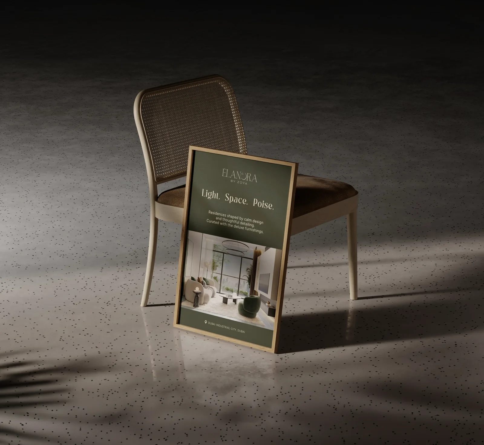 Élanora by Zoya poster frame (“Light. Space. Poise.”) leaning on a chair