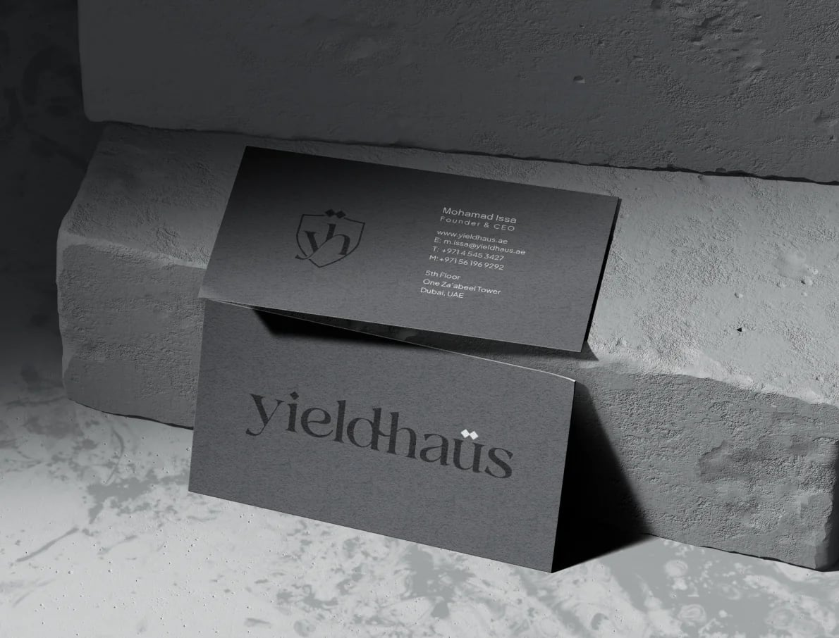 Yieldhaüs business cards on stone