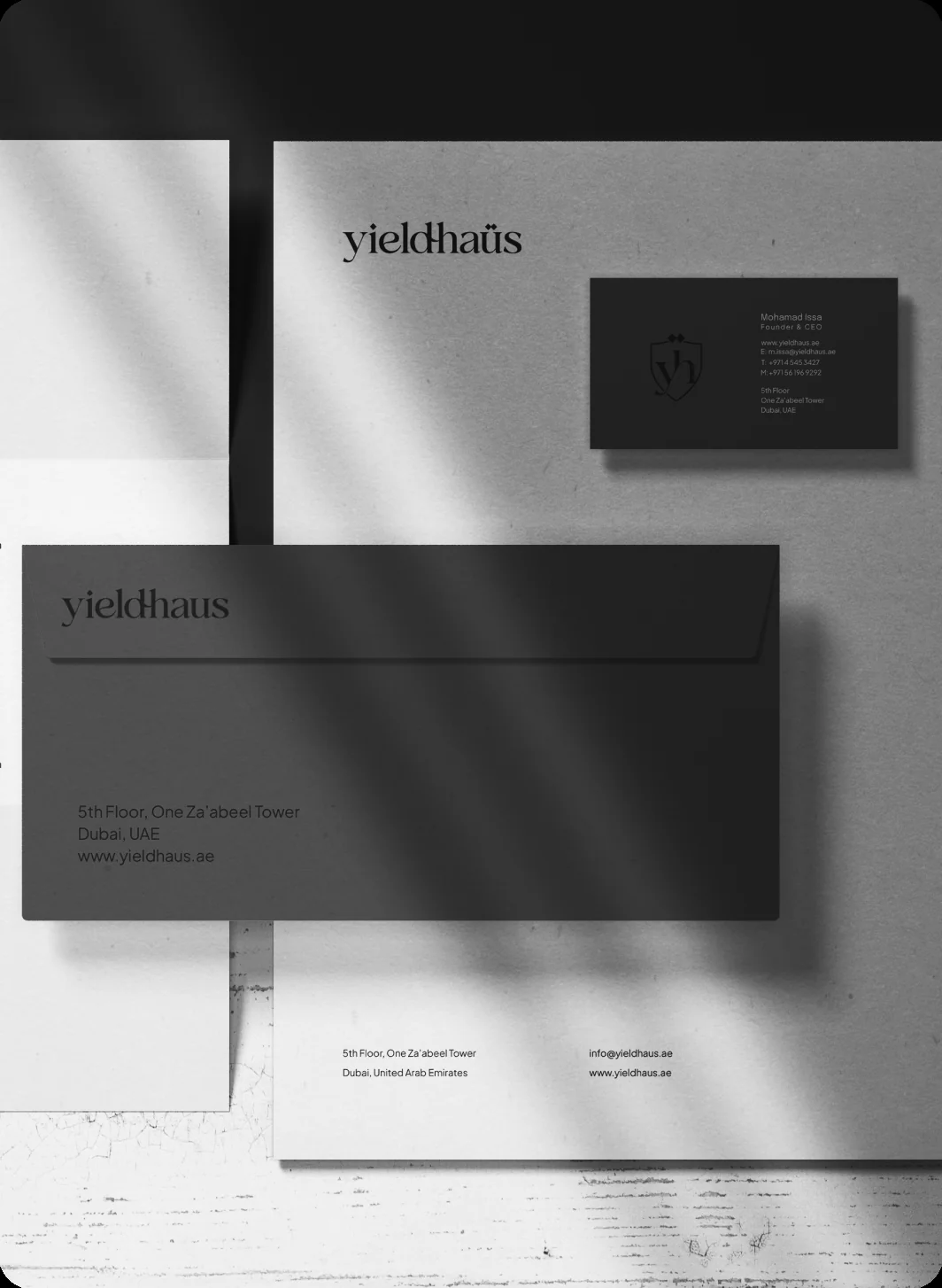 Yieldhaüs stationery, envelope and business card under window shadows