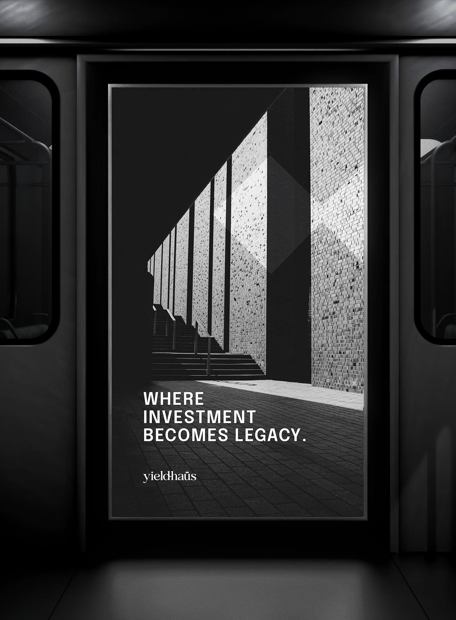 Subway car with a “WHERE INVESTMENT BECOMES LEGACY.” poster