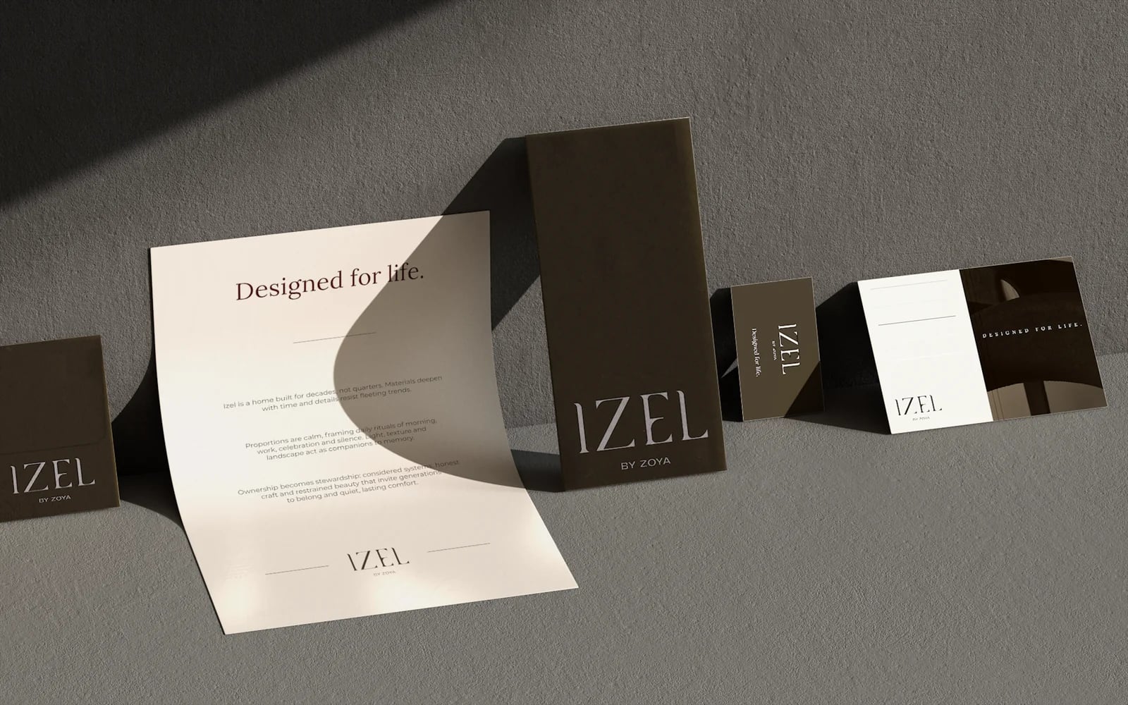 Izel by Zoya letterhead, envelope and cards on grey