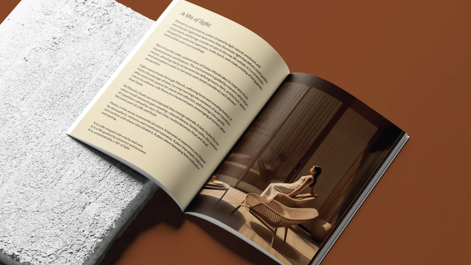 Open Miorah brochure headed “A life of light.” on concrete and rust