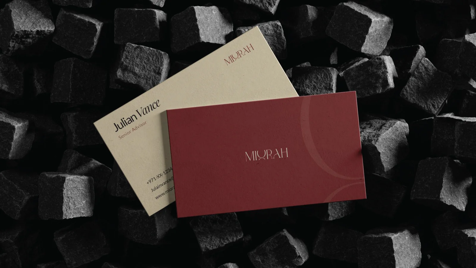 Miorah business cards on dark cobblestones
