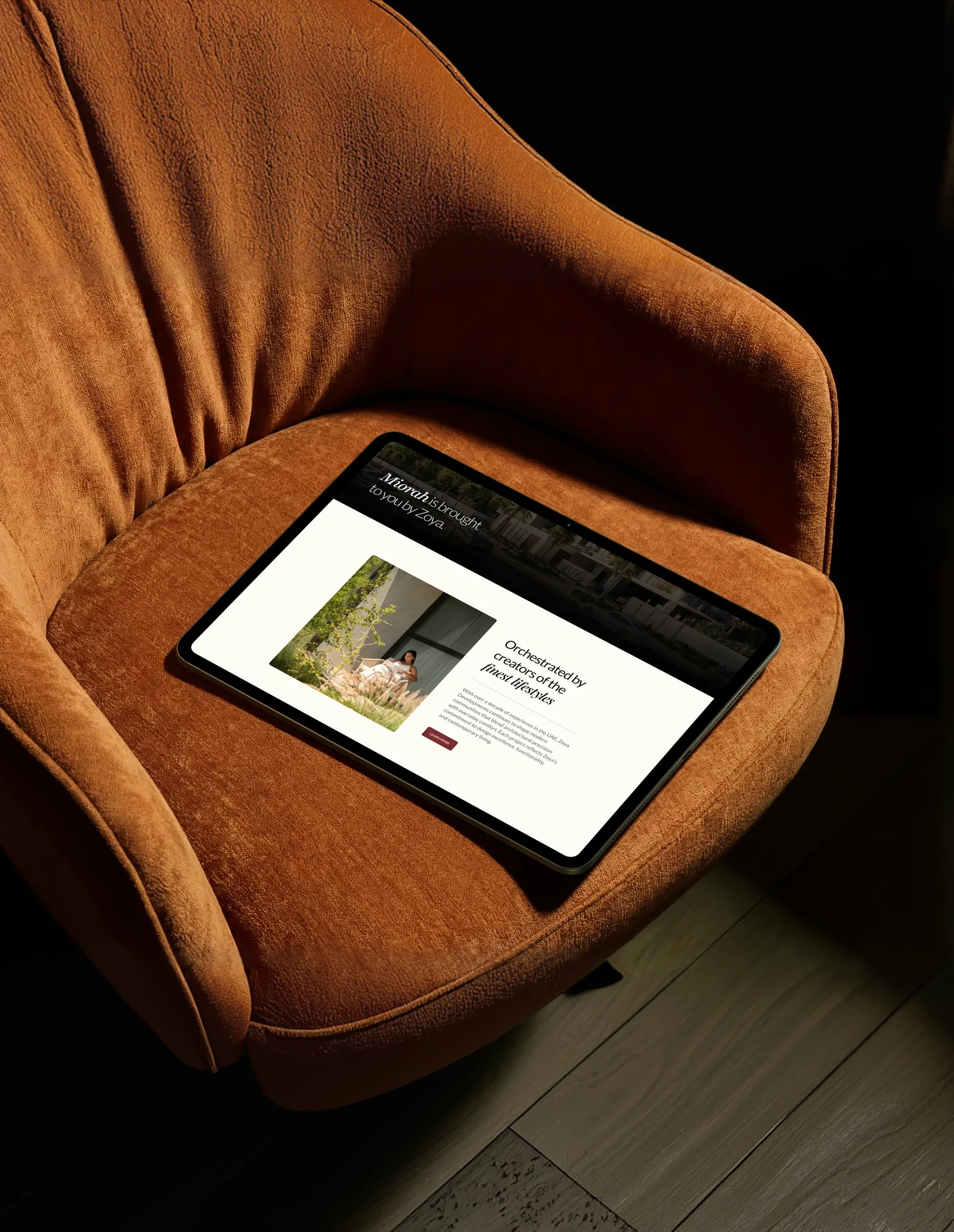 Tablet showing the Miorah website on an orange armchair