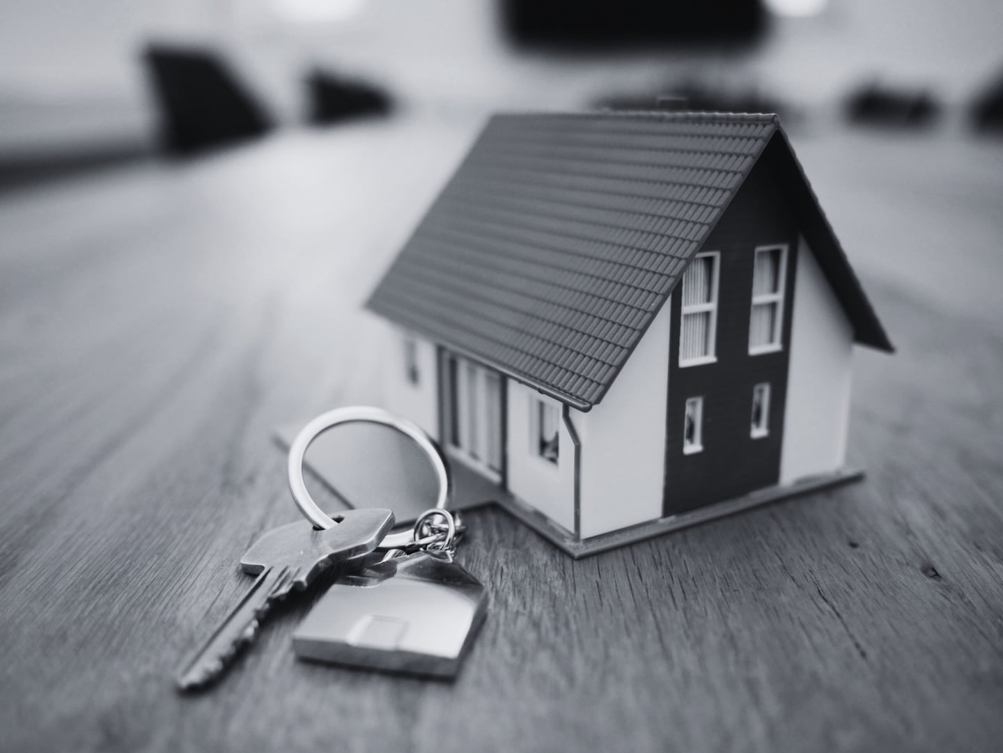 House keys and model showing real estate ownership