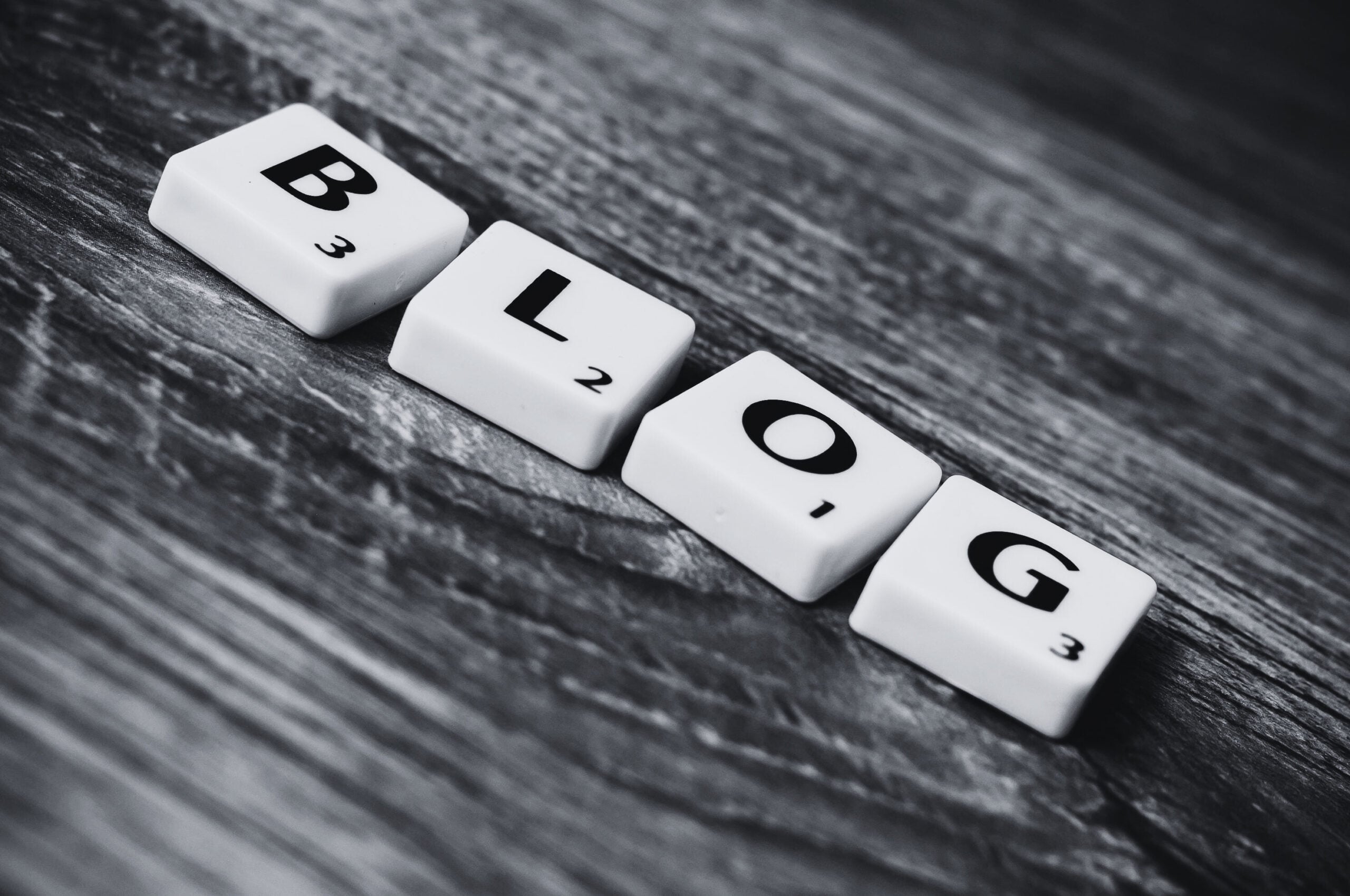 Blog letters placed on wooden surface
