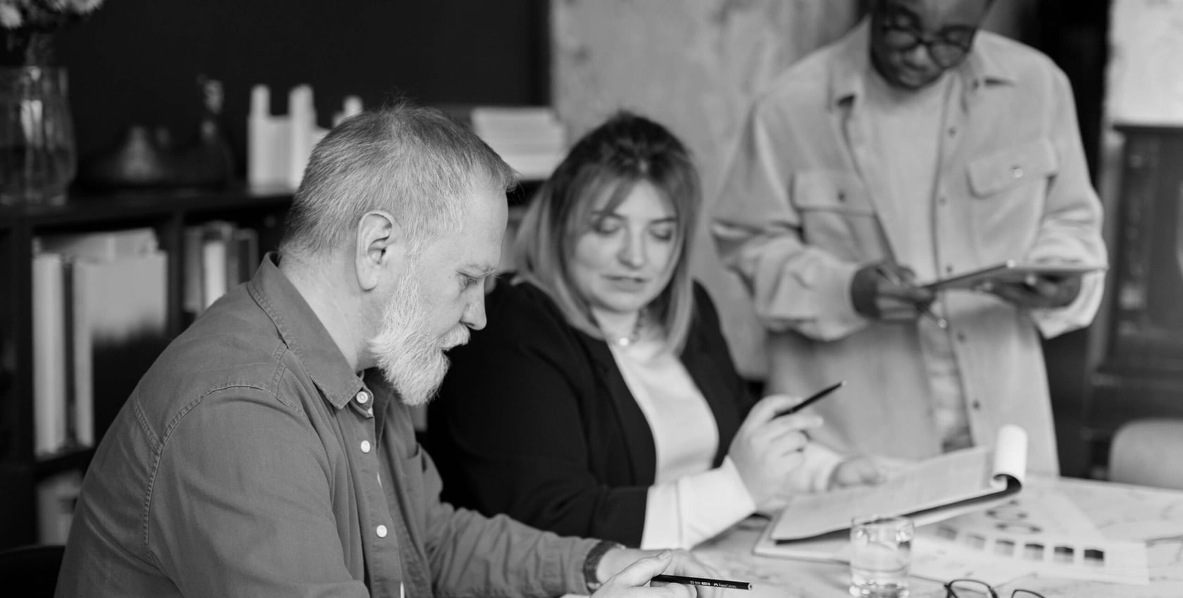 Colleagues reviewing color swatches, real estate branding design work