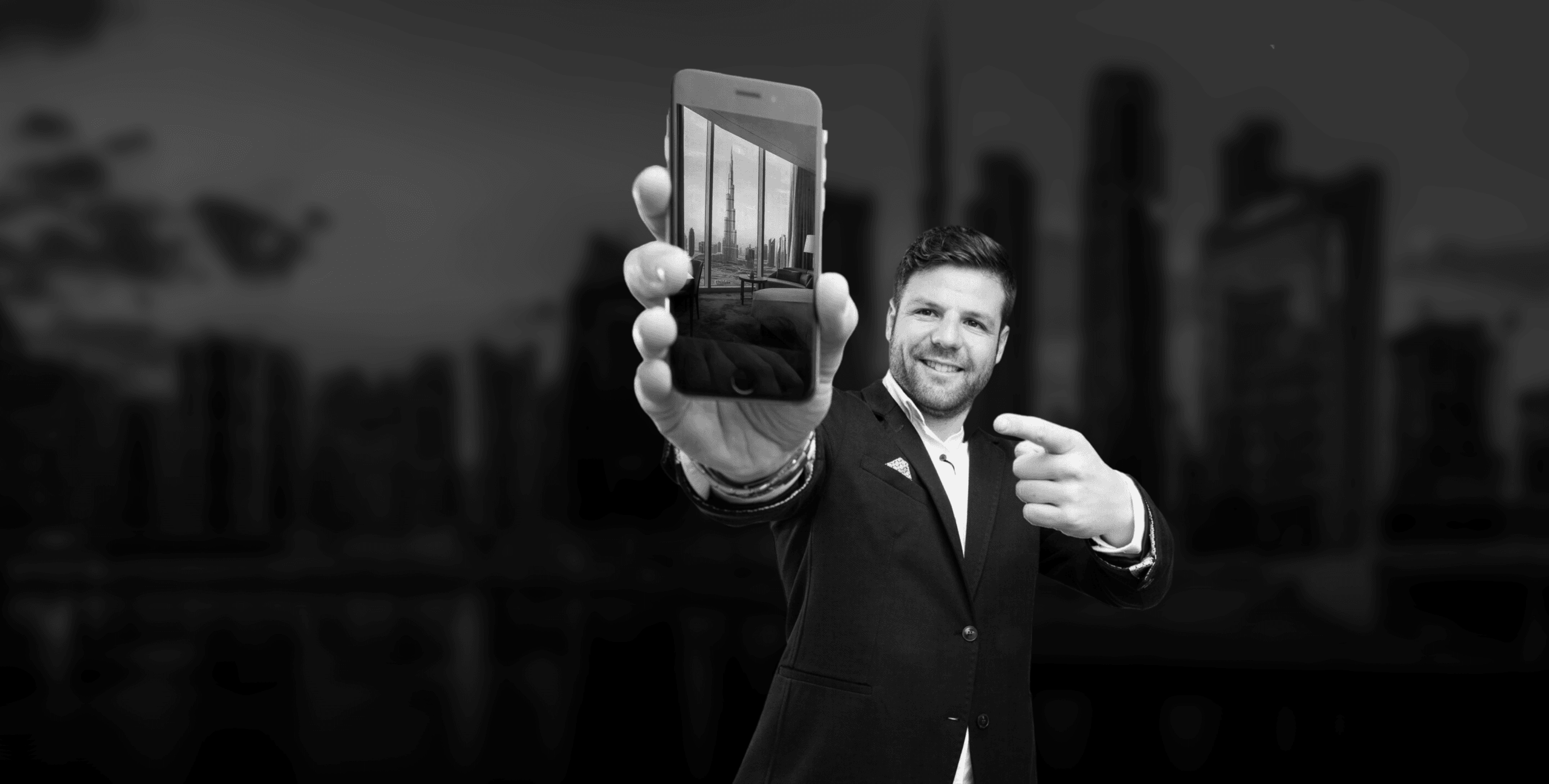 Man holding smartphone with Dubai property photo, mobile real estate marketing