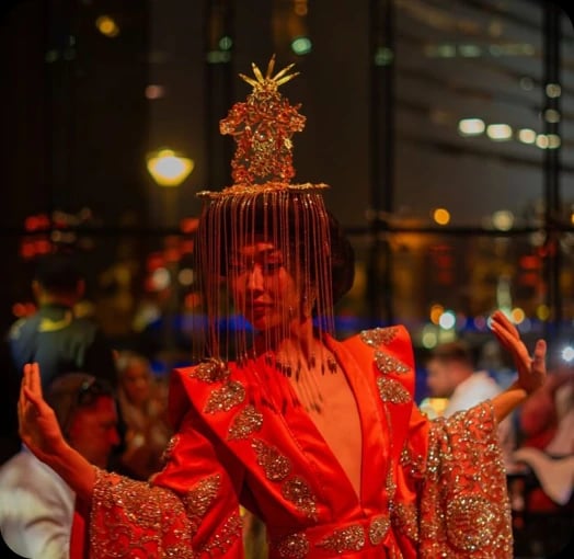 Performer in red festive costume