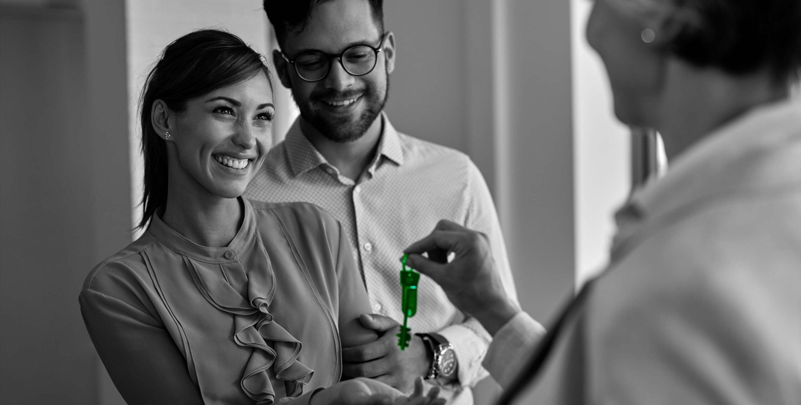 Agent handing over house keys, real estate key handover process
