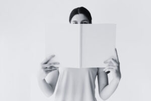 Person holding blank paper representing new ideas