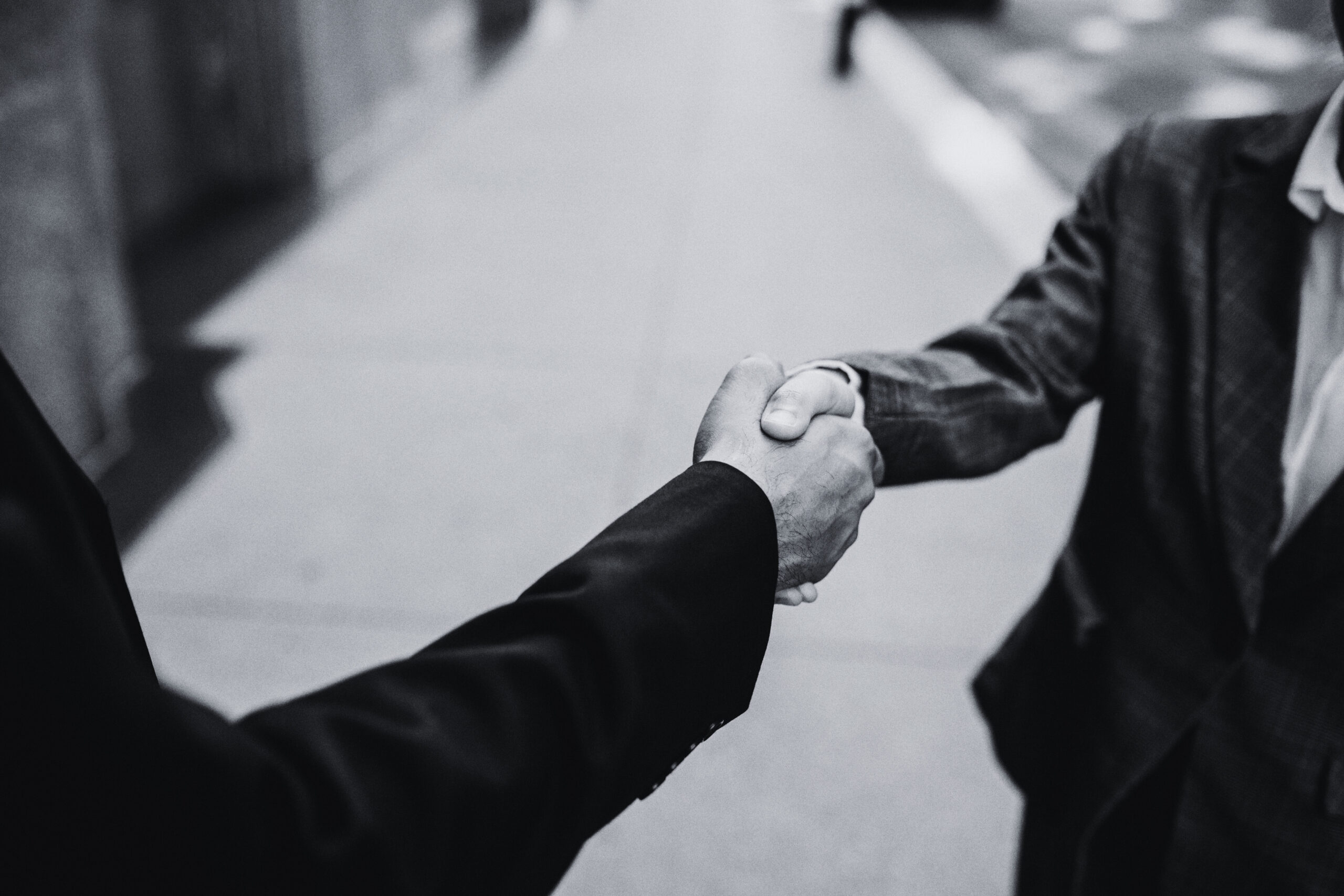 Business handshake symbolising real estate partnerships