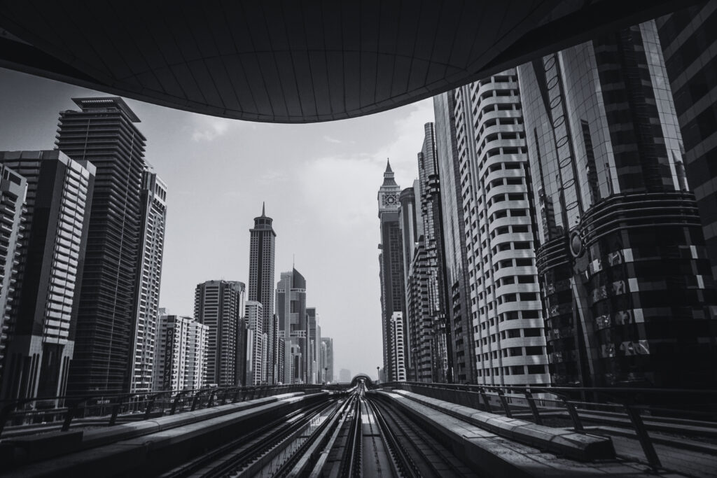Empty city road surrounded by modern high-rise buildings